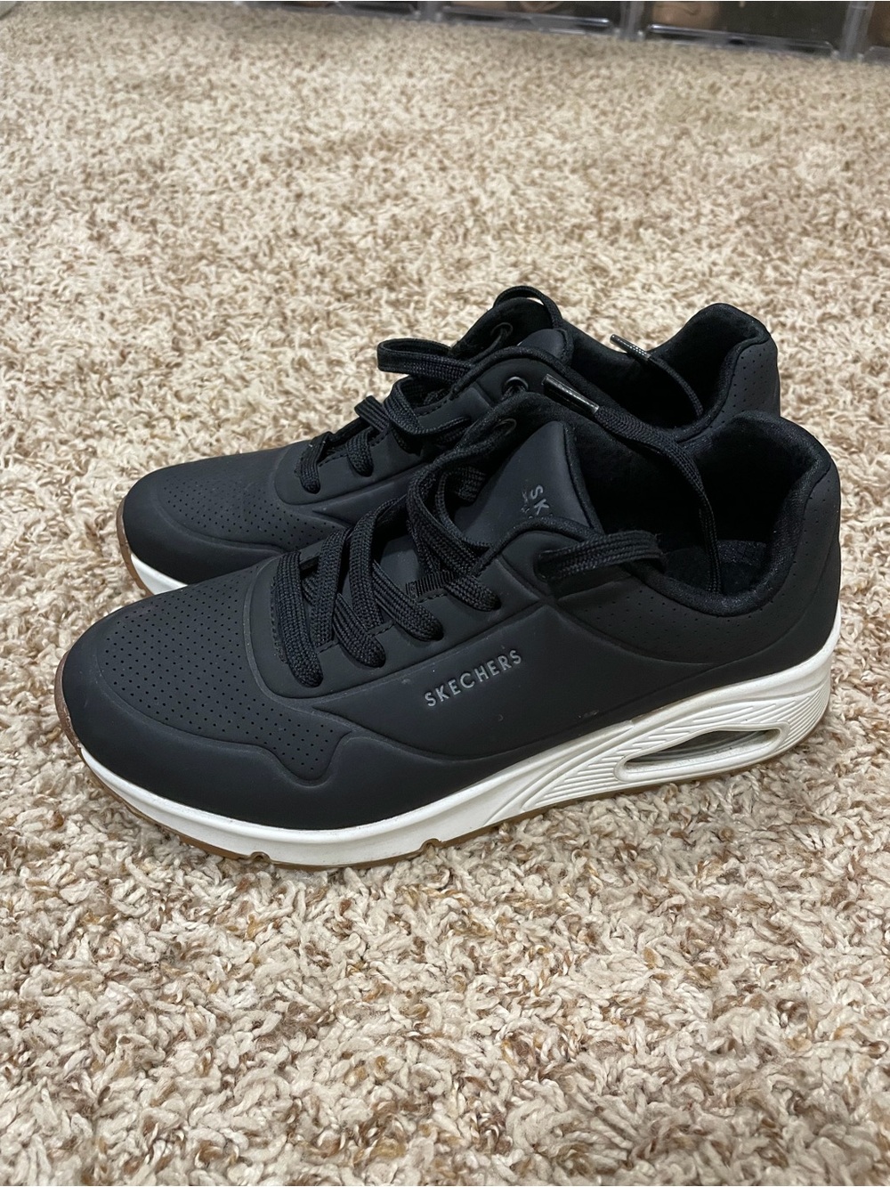 Skechers women’s Black Sneakers with White Midsole